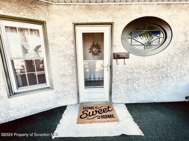 a view of a door and small window