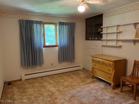 5514 Detroit Road Elyria, OH 44035 - Photo 2 of 8 Carpeted bedroom with a baseboard radiator and ceiling fan