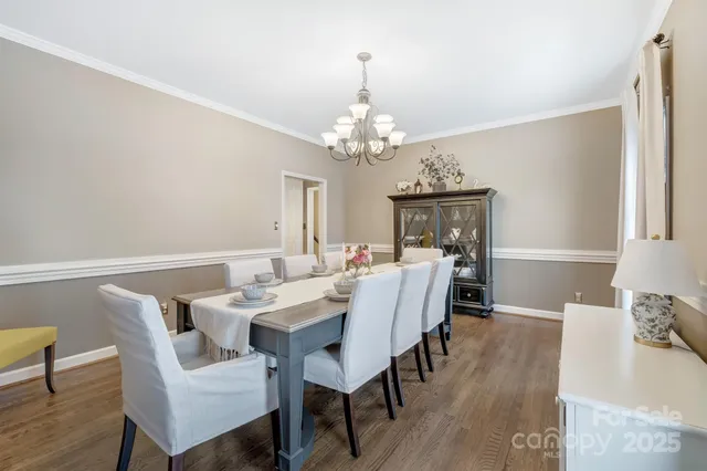 a living room with furniture and large windows