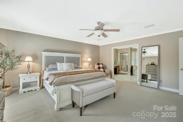 a spacious bathroom with a double vanity sink mirror and bathtub