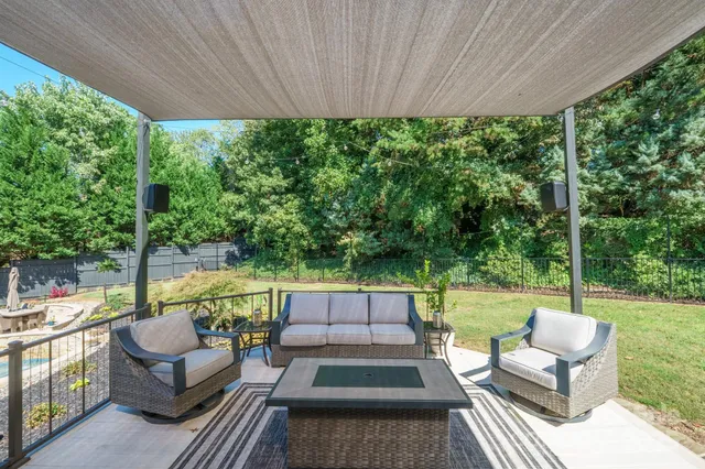 a outdoor space with patio the couches and a dining table with garden view