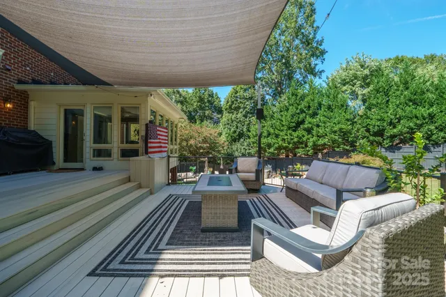 a view of a backyard with swimming pool