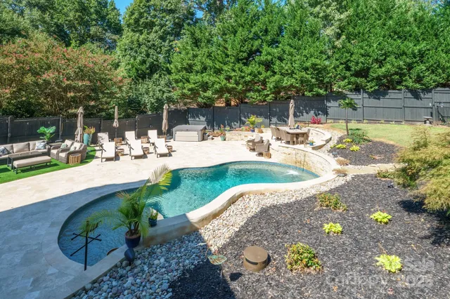 a view of a swimming pool with a patio