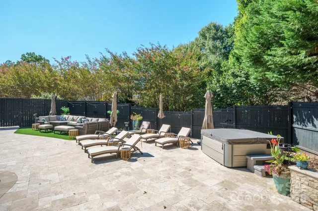 a view of a house with a yard and sitting area