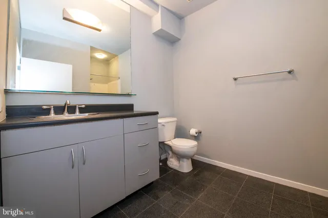 a bathroom with a glass shower door