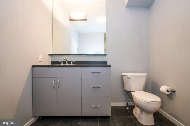 a view of an empty room with glass door and a window