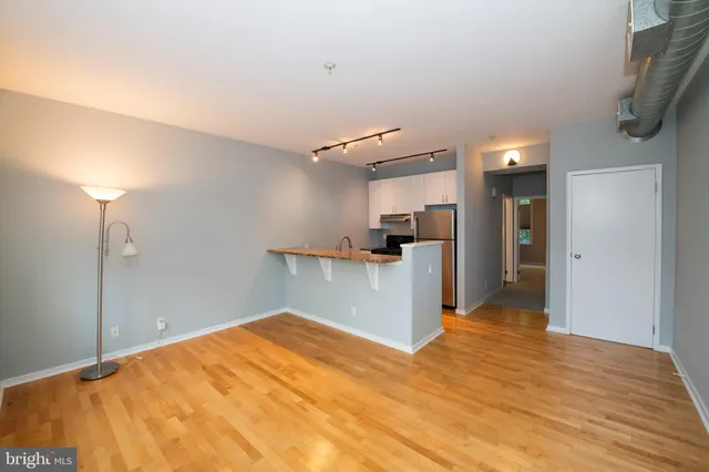 a kitchen with refrigerator a stove a sink and dishwasher