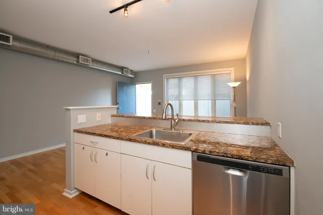 a kitchen with appliances and cabinets