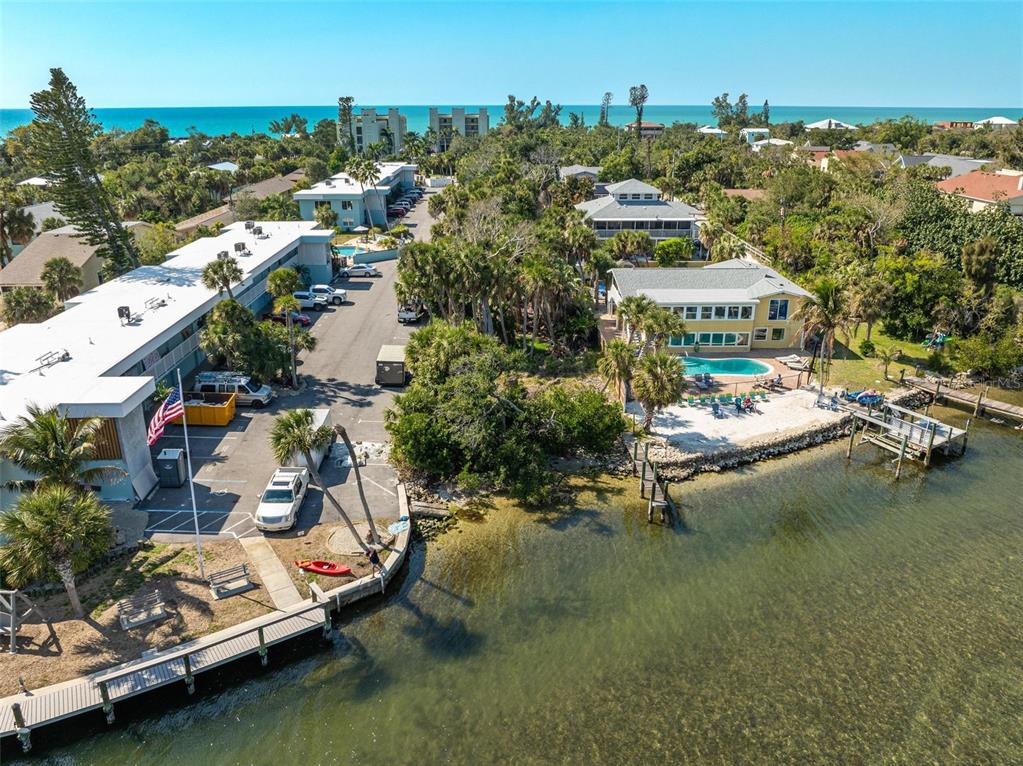 5065 North Beach Road Englewood, FL 34223 - Photo 15 of 22 an aerial view of a house with a garden and lake view