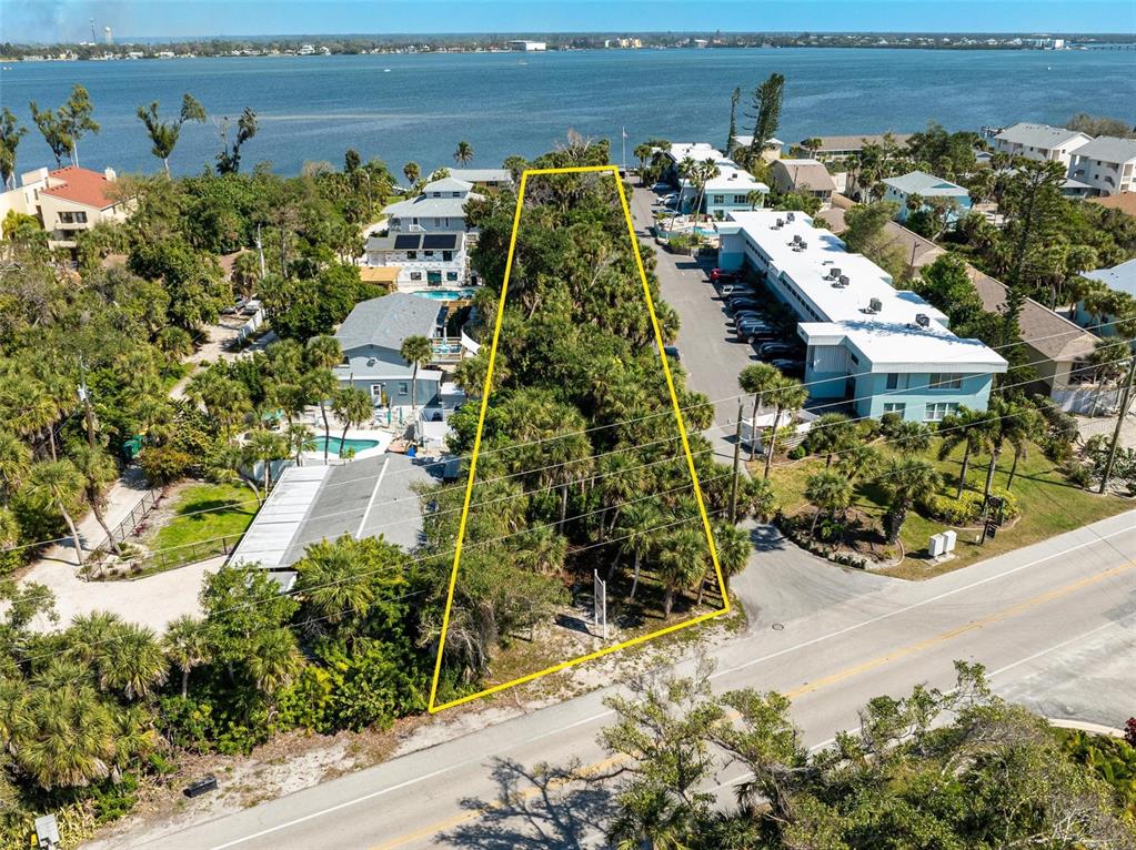 5065 North Beach Road Englewood, FL 34223 - Photo 2 of 22 an aerial view of a house with a yard