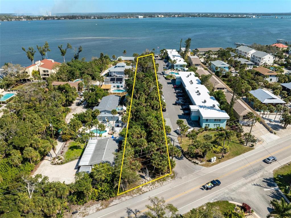 5065 North Beach Road Englewood, FL 34223 - Photo 3 of 22 an aerial view of a house with a ocean view