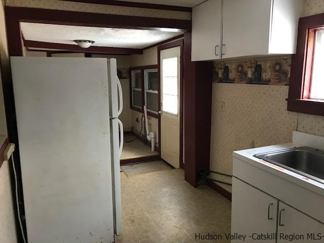 202 Rutsonville Road Wallkill, NY 12589 - Photo 3 of 10 a kitchen with a refrigerator and a sink