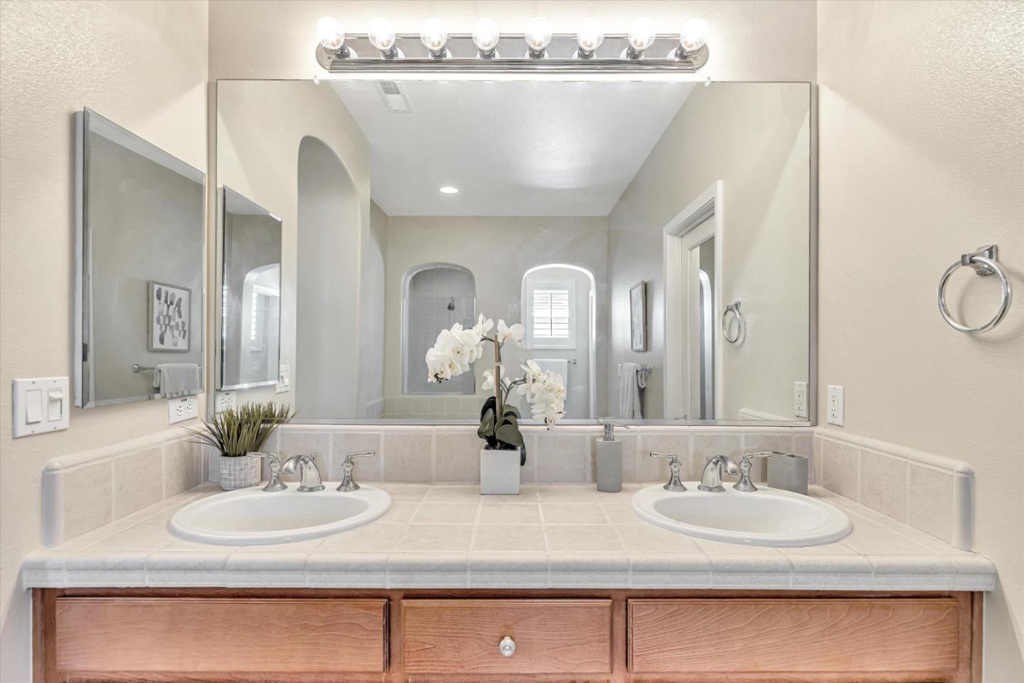 2124 Harvest Moon Lane San Ramon, CA 94582 - Photo 13 of 31 a bathroom with a double vanity sink and a mirror