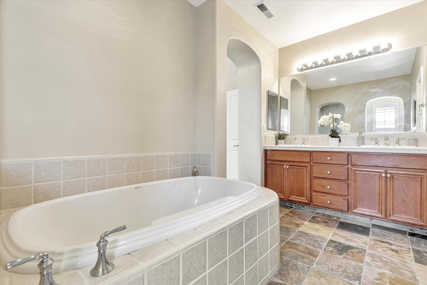 2124 Harvest Moon Lane San Ramon, CA 94582 - Photo 14 of 31 a bathroom with a tub sink and mirror