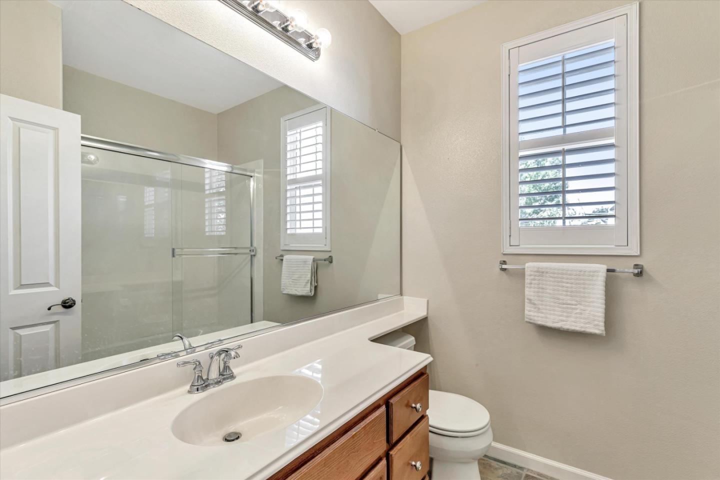 2124 Harvest Moon Lane San Ramon, CA 94582 - Photo 18 of 31 a bathroom with a sink a toilet and shower