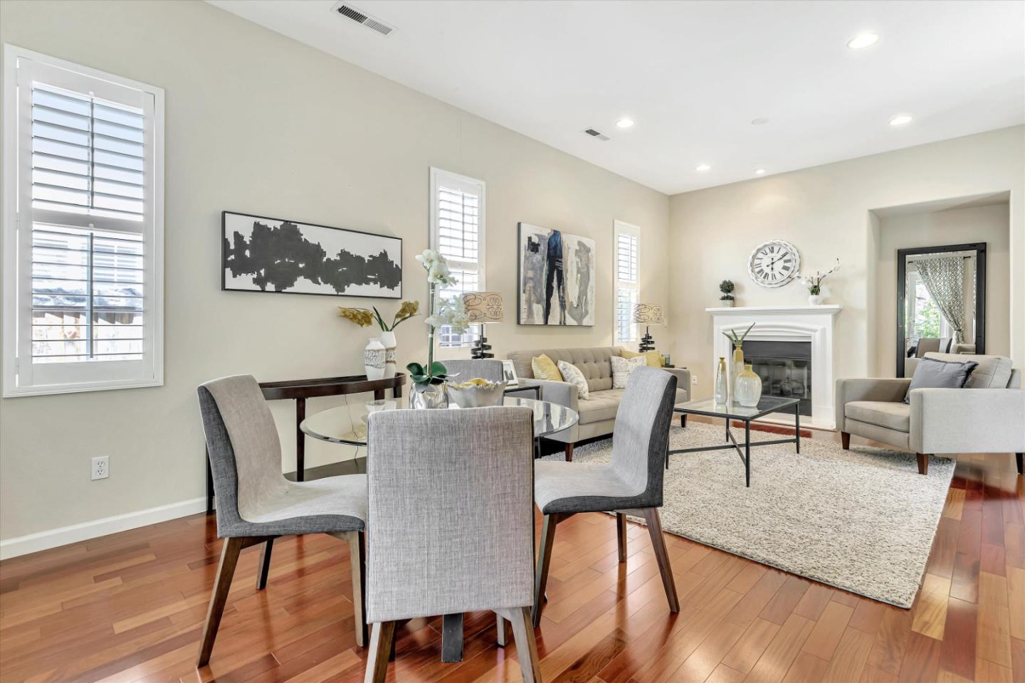 2124 Harvest Moon Lane San Ramon, CA 94582 - Photo 6 of 31 a dining room with furniture a fireplace and wooden floor