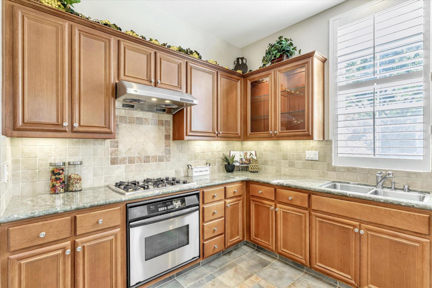 2124 Harvest Moon Lane San Ramon, CA 94582 - Photo 8 of 31 a kitchen with stainless steel appliances granite countertop a sink stove and cabinets