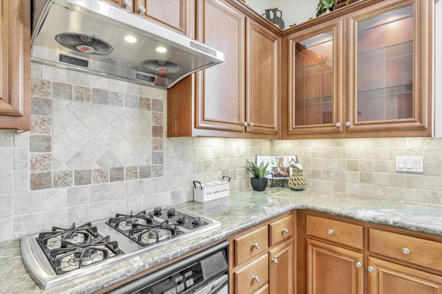 2124 Harvest Moon Lane San Ramon, CA 94582 - Photo 9 of 31 a kitchen with stainless steel appliances granite countertop a stove a sink dishwasher and cabinets with wooden floor