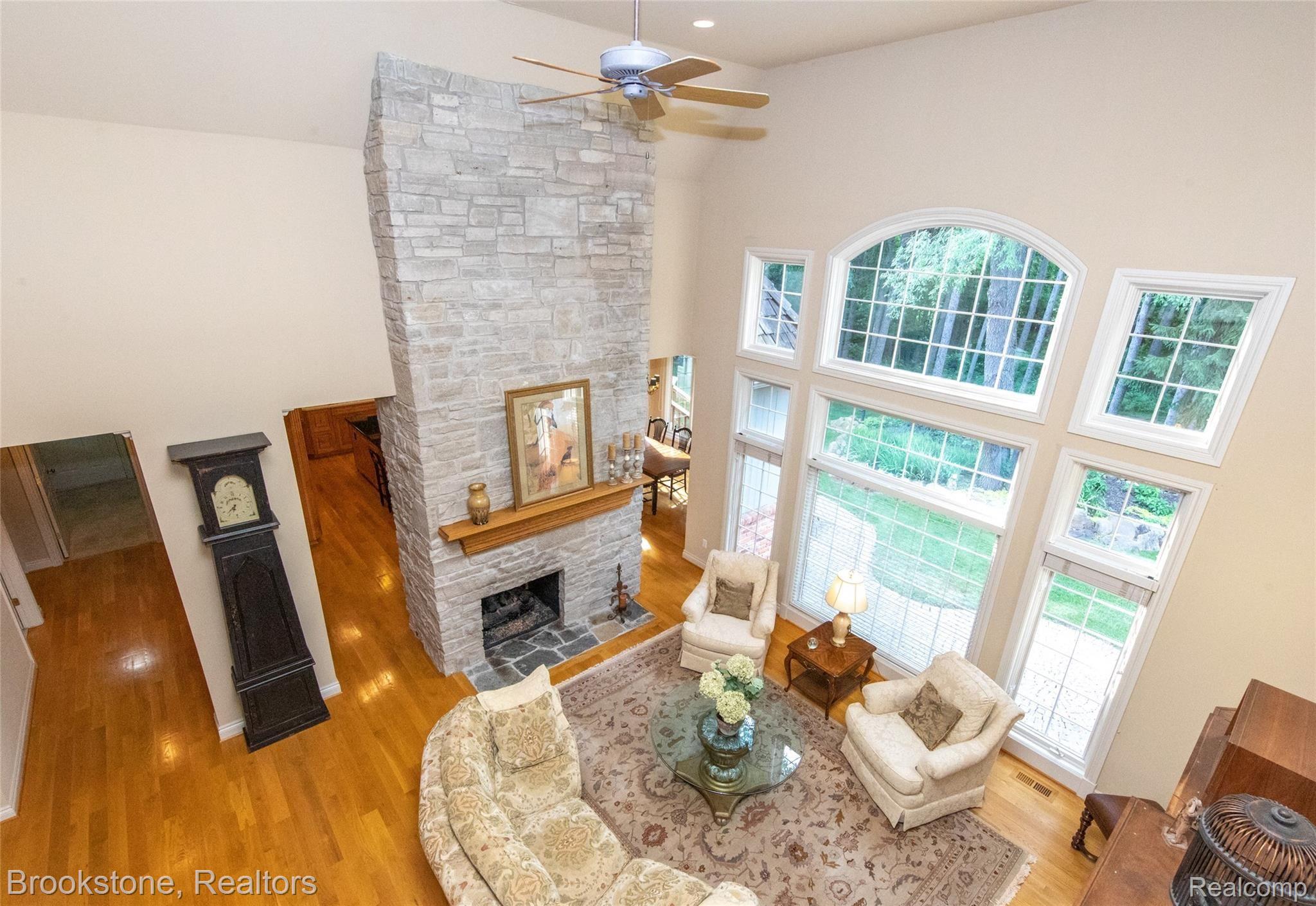 7608 Devins Ridge Clarkston, MI 48348 - Photo 20 of 42 Stunning 2 Story Stone Fireplace