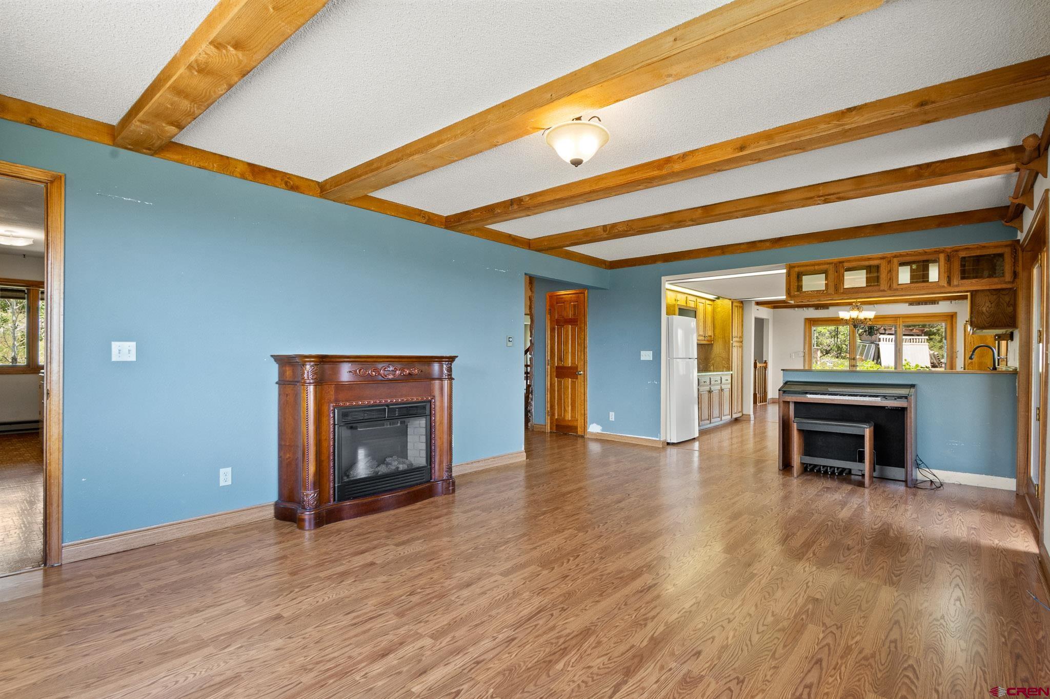 21565 Highway 65 Cedaredge, CO 81413 - Photo 13 of 42 a view of an empty room and fire place
