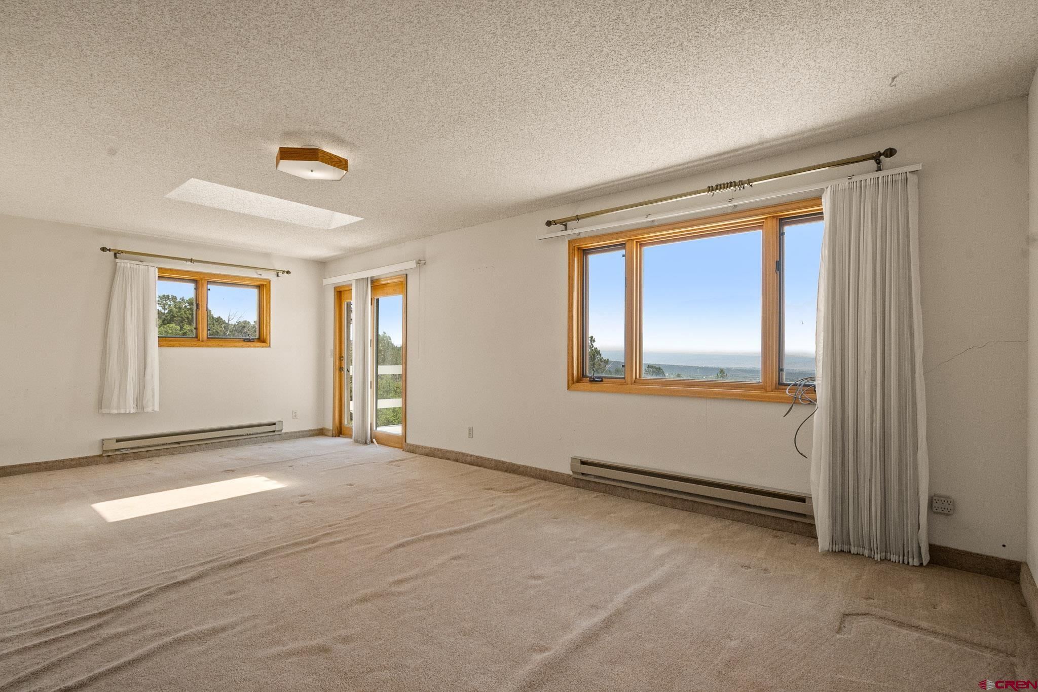 21565 Highway 65 Cedaredge, CO 81413 - Photo 19 of 42 a view of an empty room with window