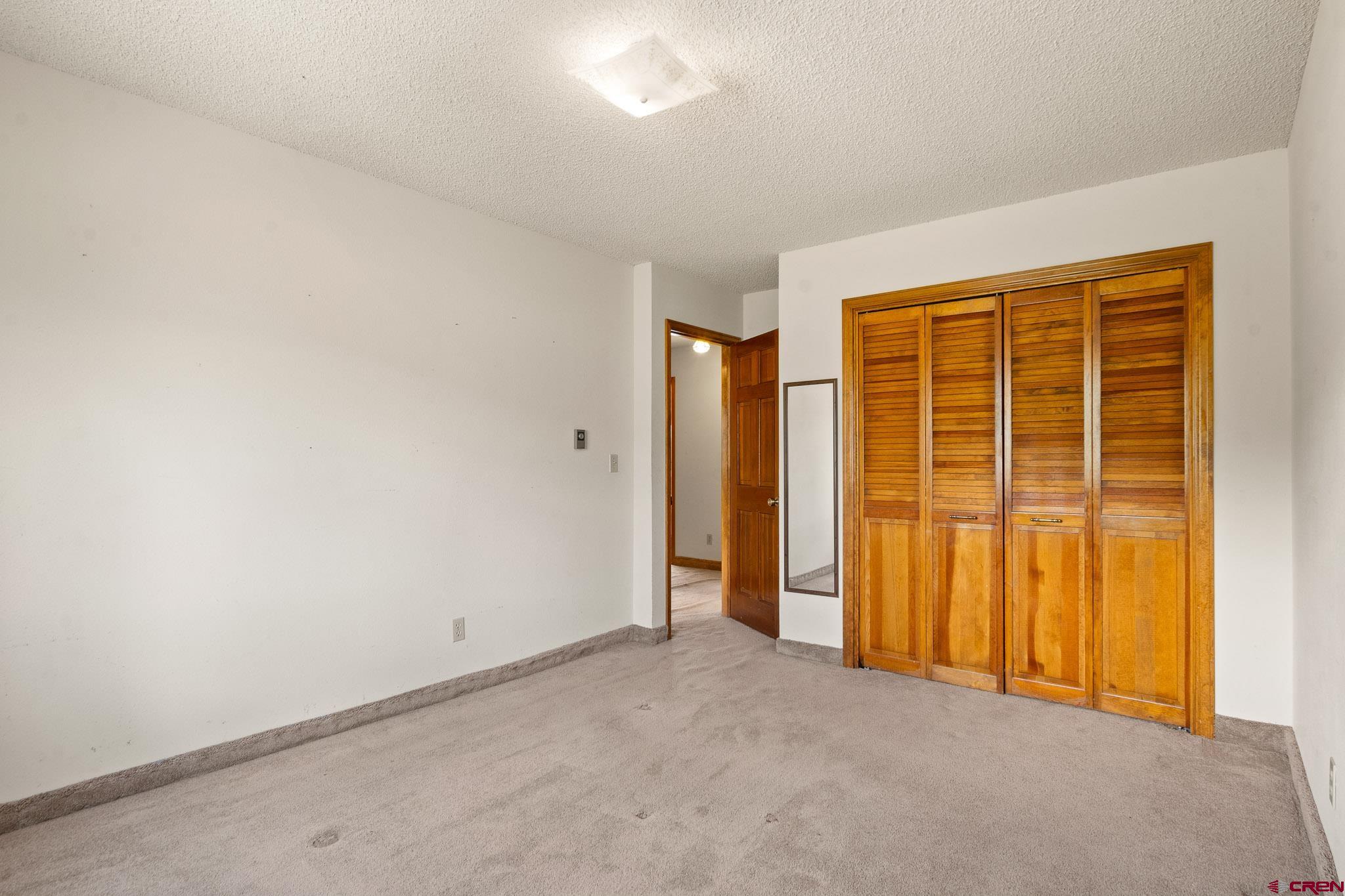 21565 Highway 65 Cedaredge, CO 81413 - Photo 24 of 42 an empty room with a natural light