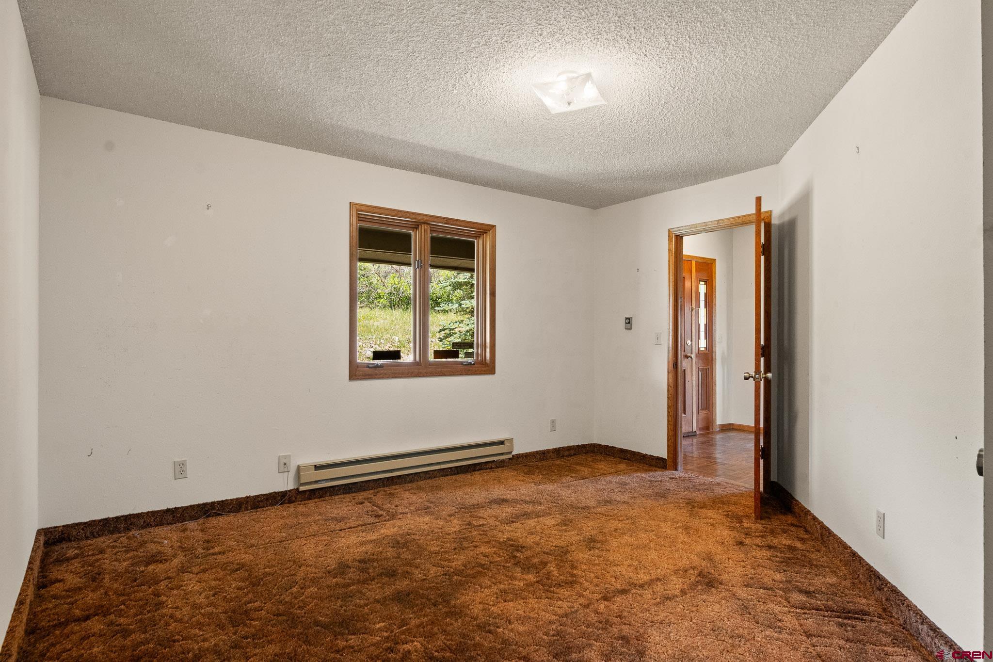 21565 Highway 65 Cedaredge, CO 81413 - Photo 26 of 42 an empty room with windows