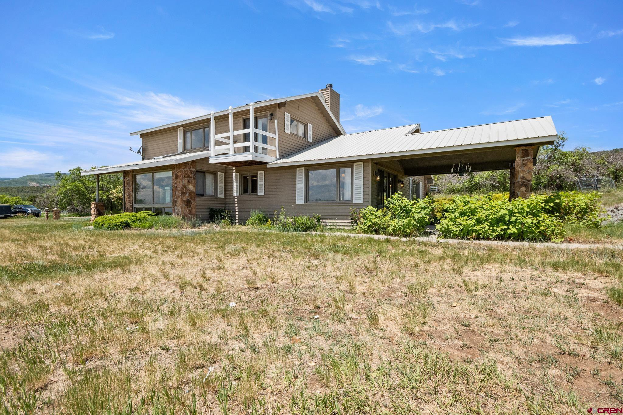 21565 Highway 65 Cedaredge, CO 81413 - Photo 33 of 42 a front view of house with yard