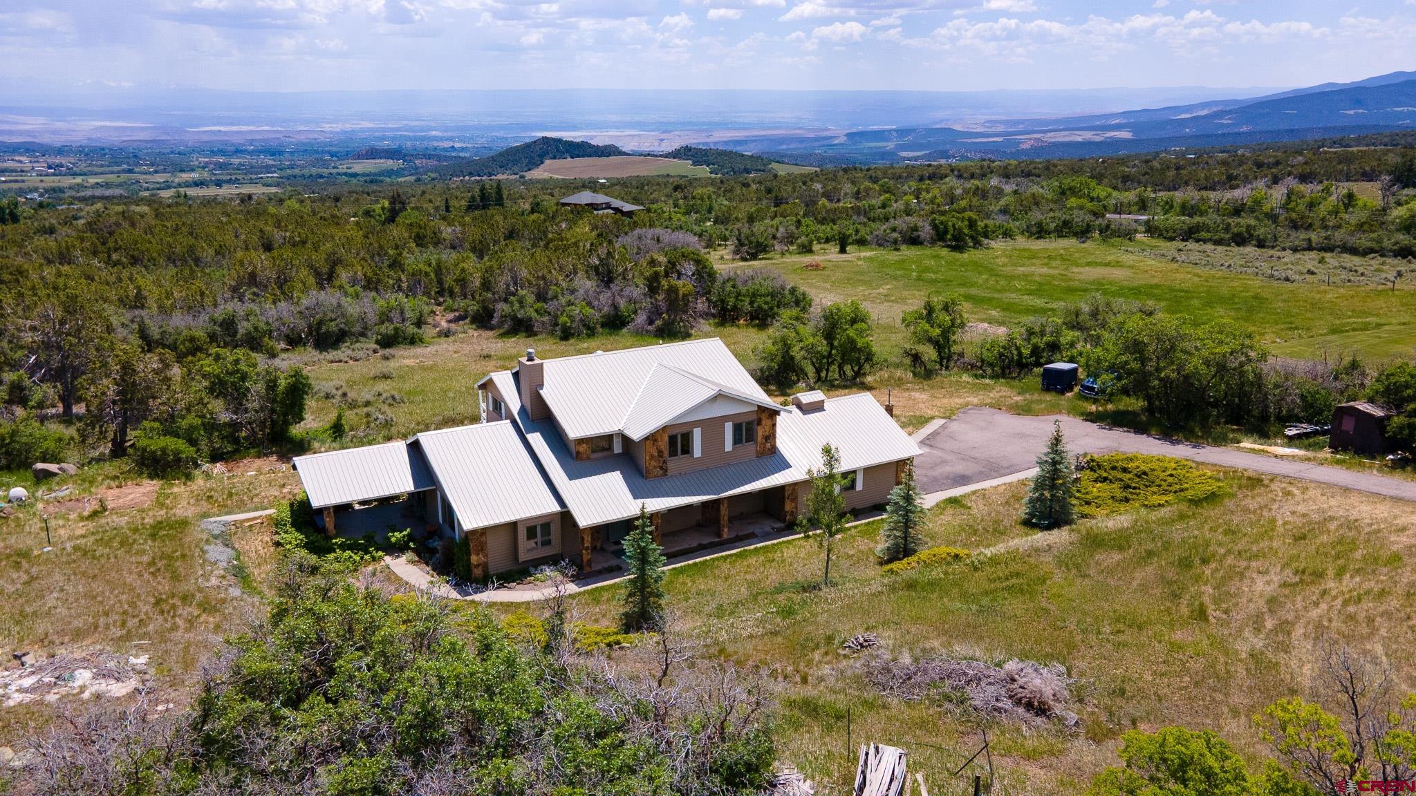 21565 Highway 65 Cedaredge, CO 81413 - Photo 34 of 42 a aerial view of a garden with lounge chairs