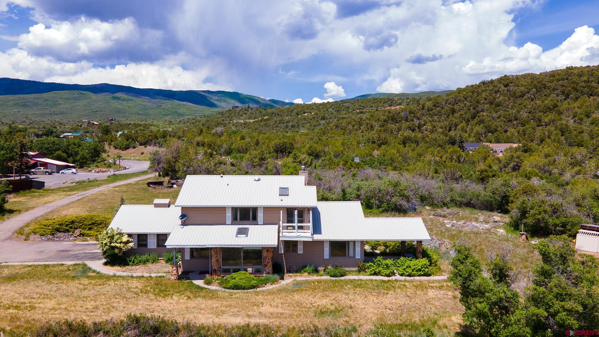 21565 Highway 65 Cedaredge, CO 81413 - Photo 37 of 42 a aerial view of a house with a big yard
