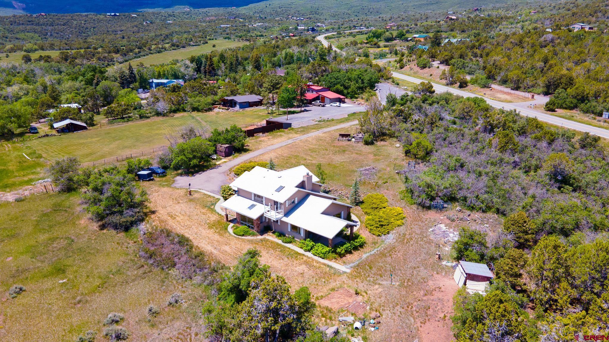 21565 Highway 65 Cedaredge, CO 81413 - Photo 38 of 42 an aerial view of house with a yard