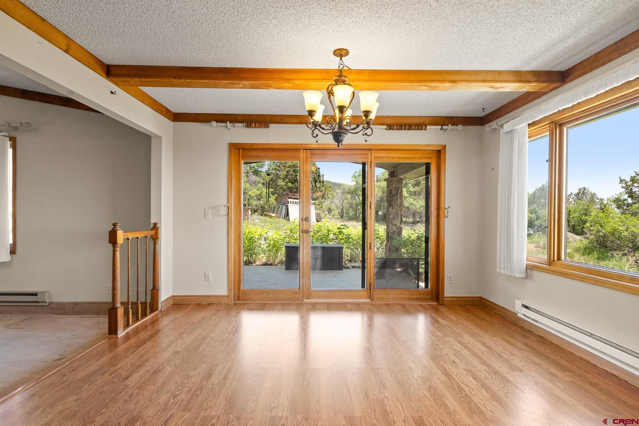 21565 Highway 65 Cedaredge, CO 81413 - Photo 7 of 42 a view of a room with wooden floor and door