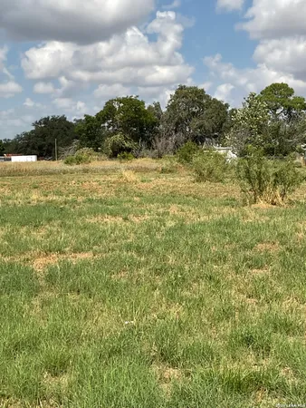 a view of a lake with houses in the back