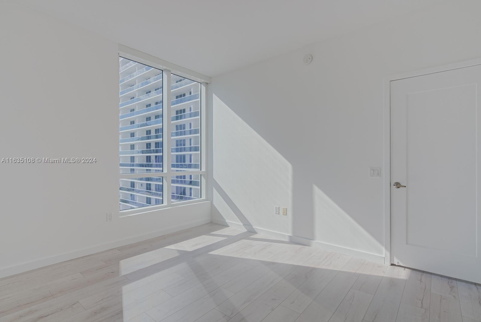 601 Northeast 27th Street, Unit 1502 Miami, FL 33137 - Photo 19 of 61 a view of an empty room with a window