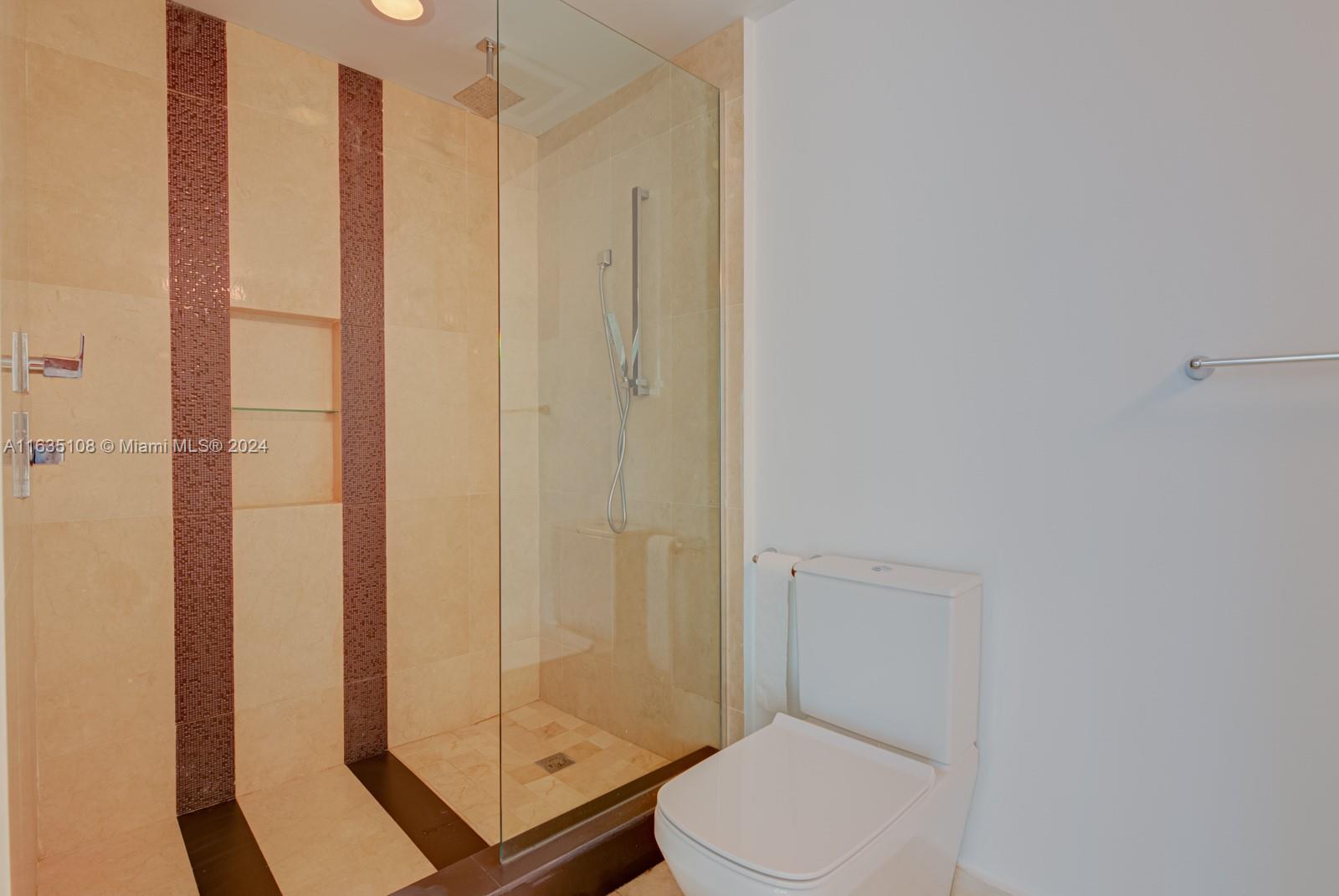 601 Northeast 27th Street, Unit 1502 Miami, FL 33137 - Photo 21 of 61 a bathroom with a toilet and shower