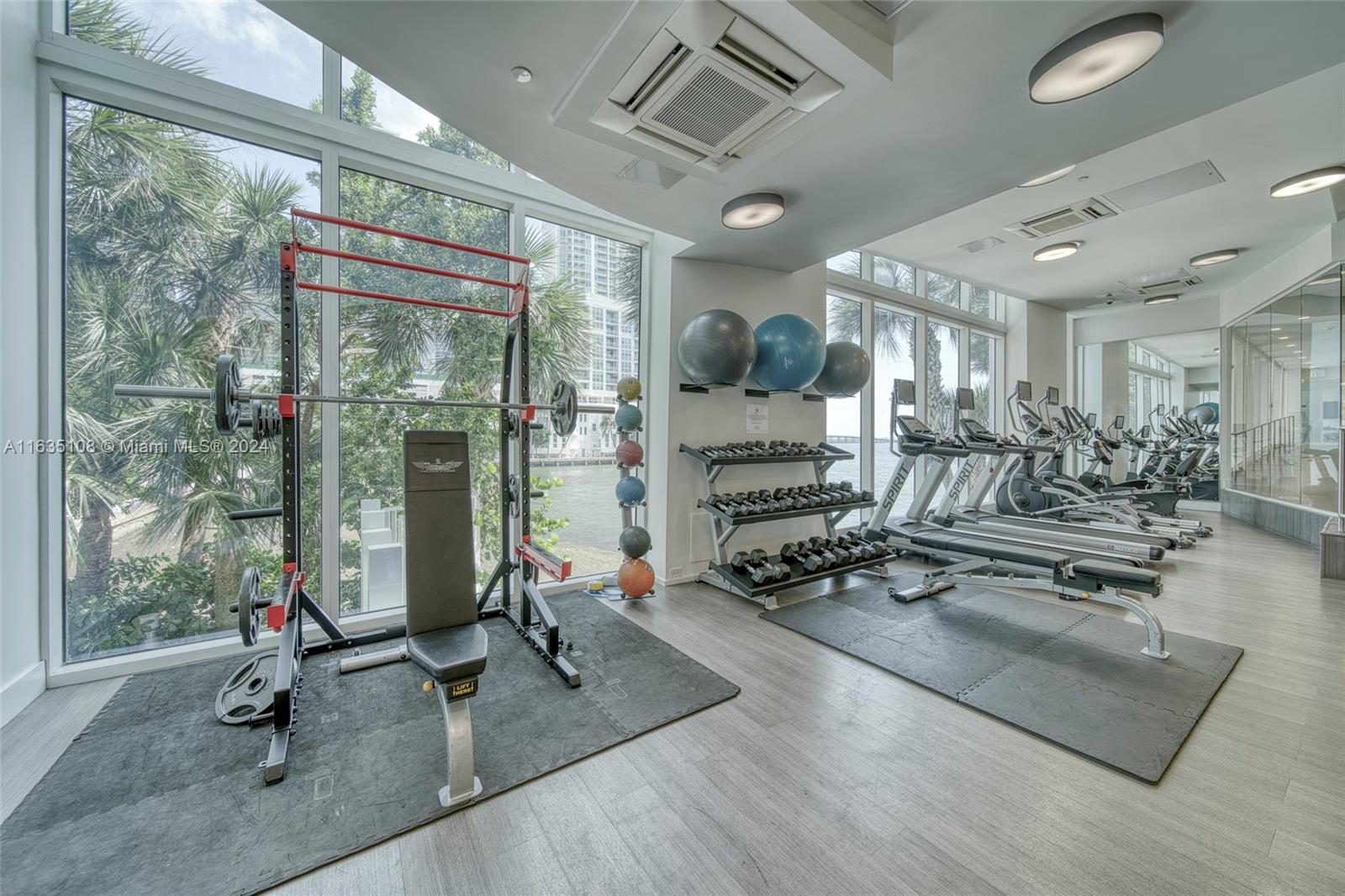 601 Northeast 27th Street, Unit 1502 Miami, FL 33137 - Photo 44 of 61 a view of a room with gym equipment