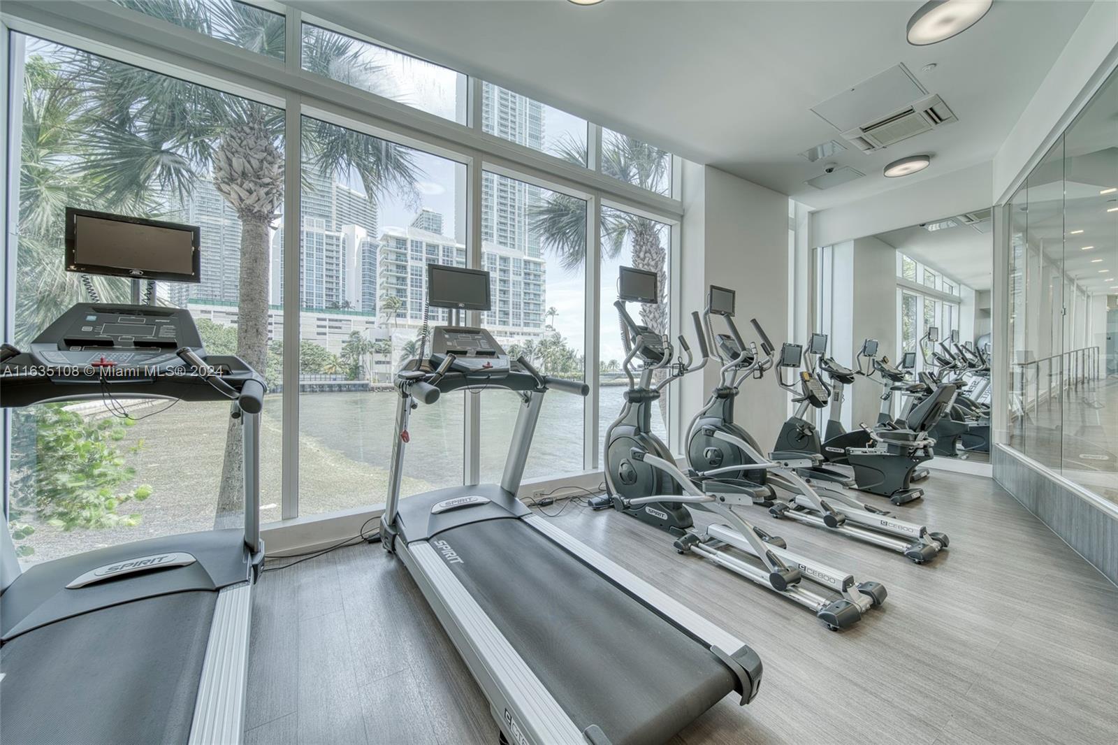 601 Northeast 27th Street, Unit 1502 Miami, FL 33137 - Photo 46 of 61 a view of a room with gym equipment