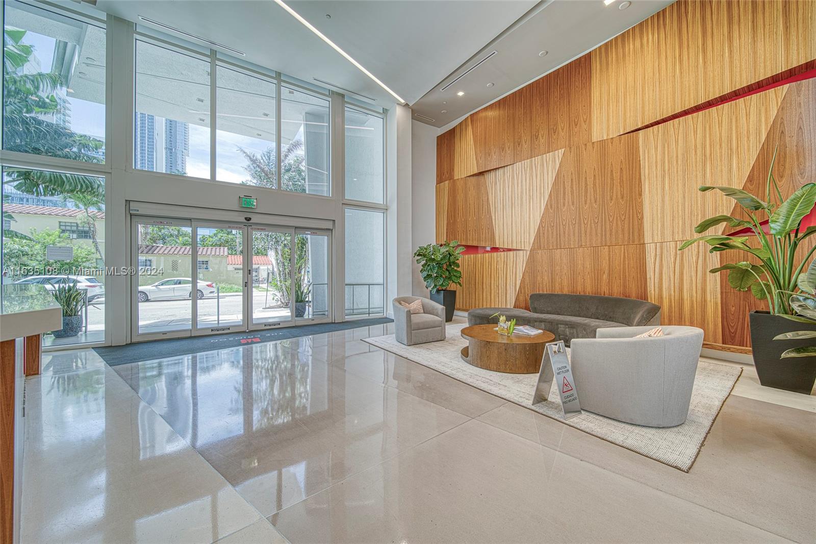 601 Northeast 27th Street, Unit 1502 Miami, FL 33137 - Photo 48 of 61 a living room with furniture and floor to ceiling windows