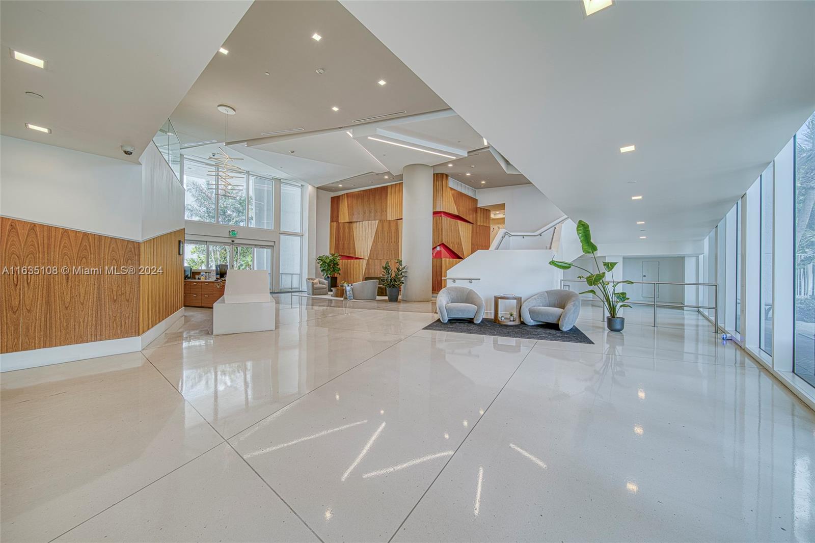 601 Northeast 27th Street, Unit 1502 Miami, FL 33137 - Photo 50 of 61 a living room with furniture and a table