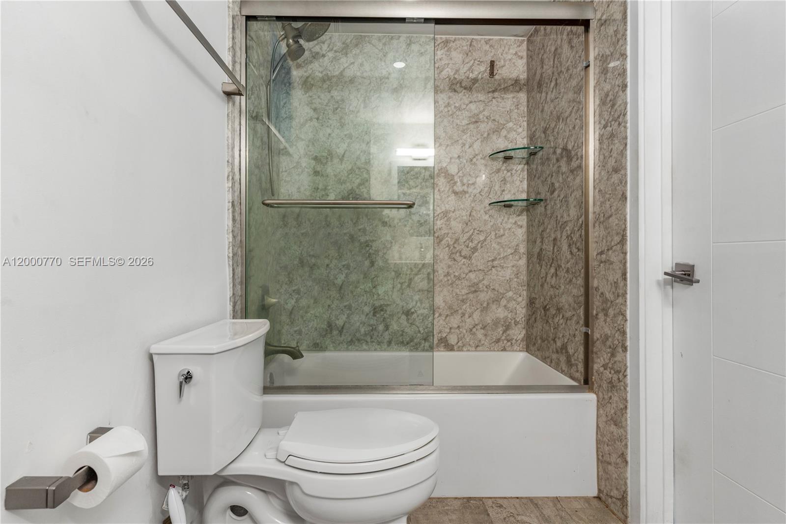 3339 Virginia Street, Unit 339 Miami, FL 33133 - Photo 15 of 24 a bathroom with a toilet and a shower