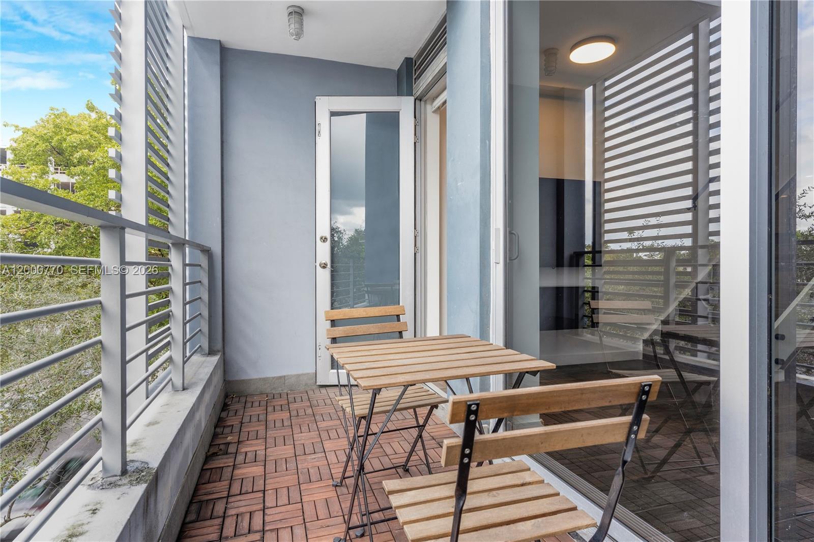 3339 Virginia Street, Unit 339 Miami, FL 33133 - Photo 19 of 24 a view of a hallway with seating area