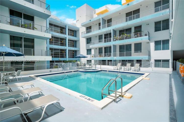 3339 Virginia Street, Unit 339 Miami, FL 33133 - Photo 20 of 24 a view of a building with a swimming pool