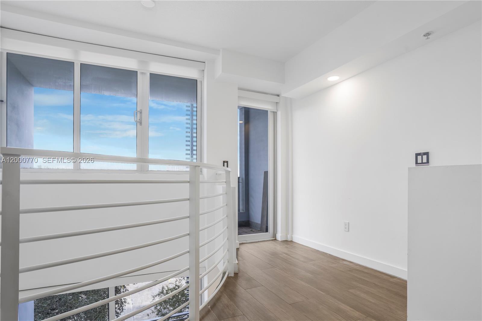 3339 Virginia Street, Unit 339 Miami, FL 33133 - Photo 7 of 24 a view of walk in closet with empty racks