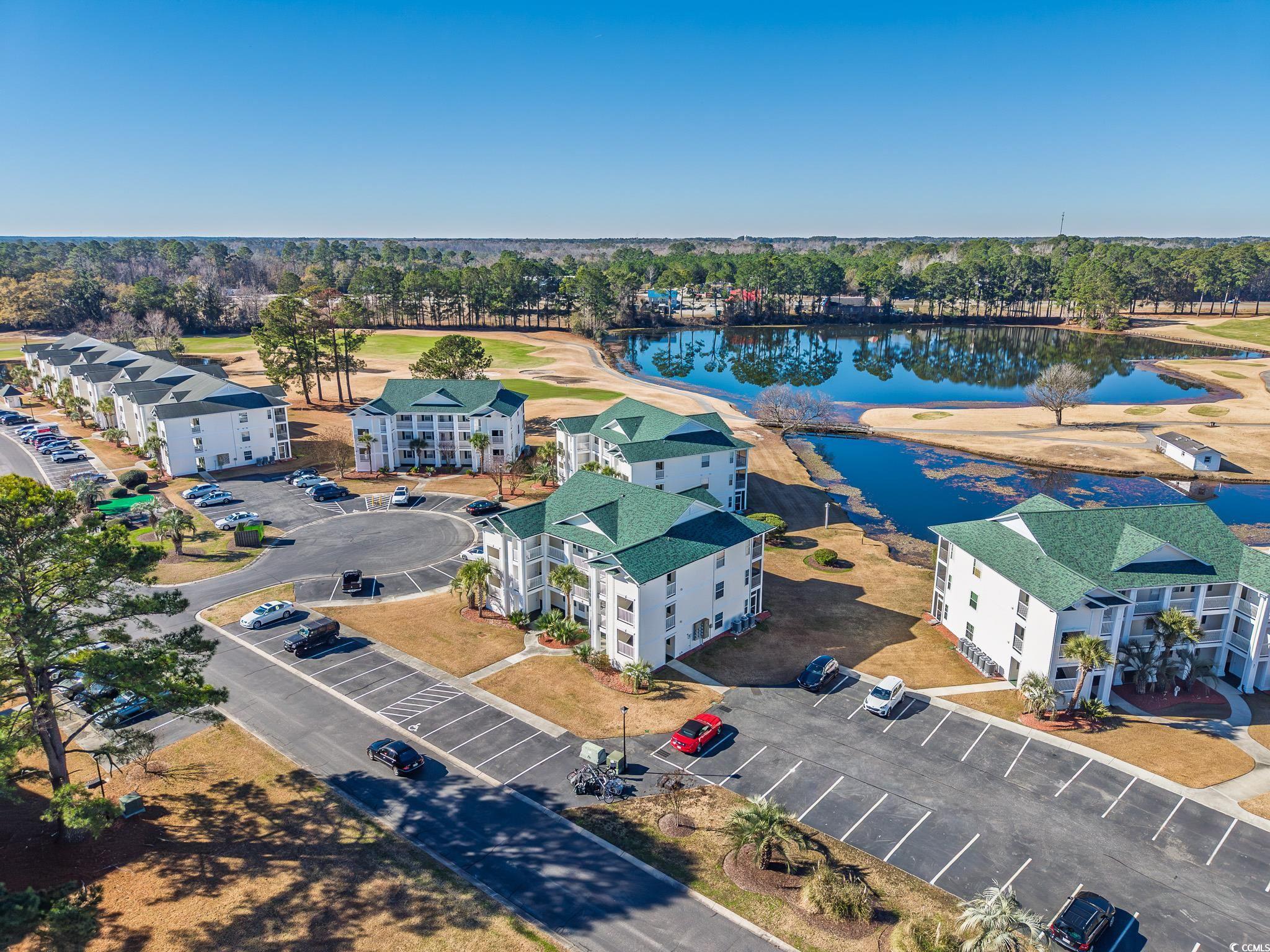 673 Tupelo Lane, Unit 19H Longs, SC 29568 - Photo 15 of 22 Drone / aerial view of a nearby body of water and a golf course