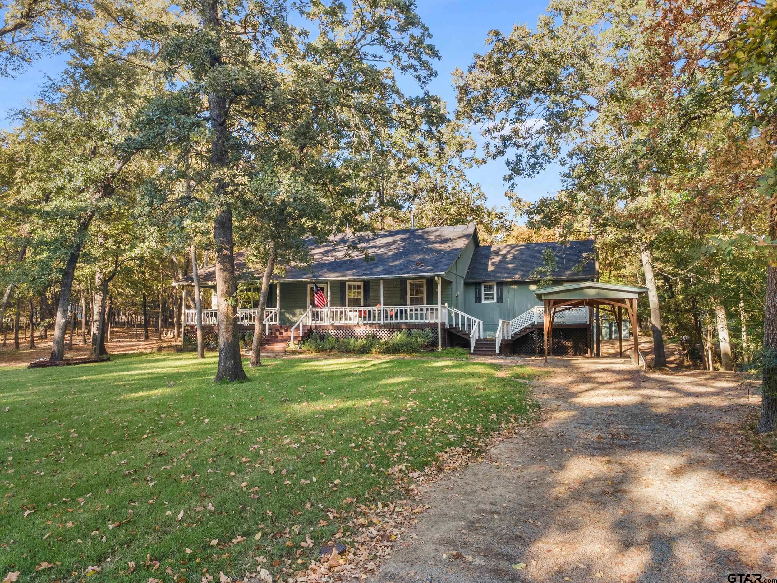 109 King Lyle Road Scroggins, TX 75480 - Photo 5 of 48 a front view of a house with a garden