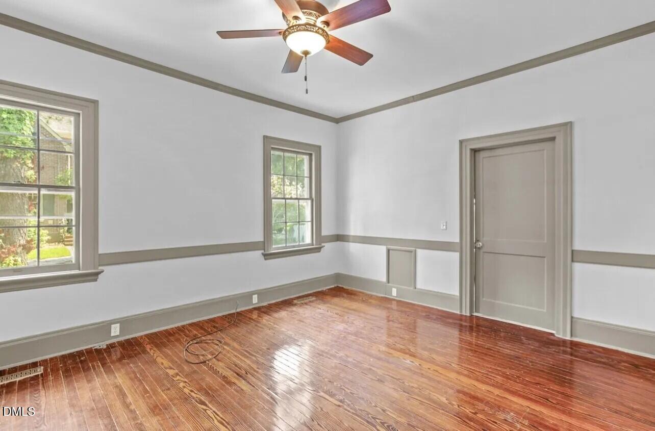 620 Falls Road Rocky Mount, NC 27804 - Photo 7 of 13 wooden floor in an empty room with a window