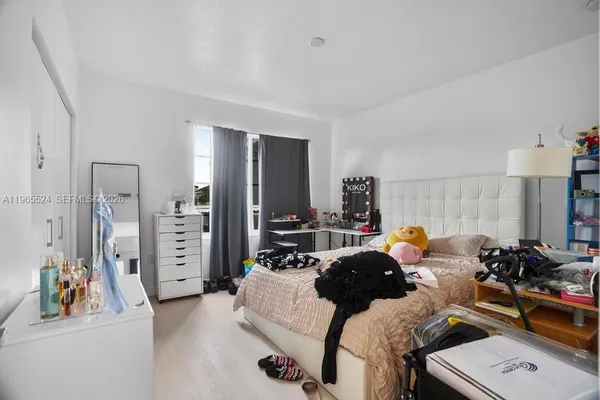 a bed room with a bed and a couch