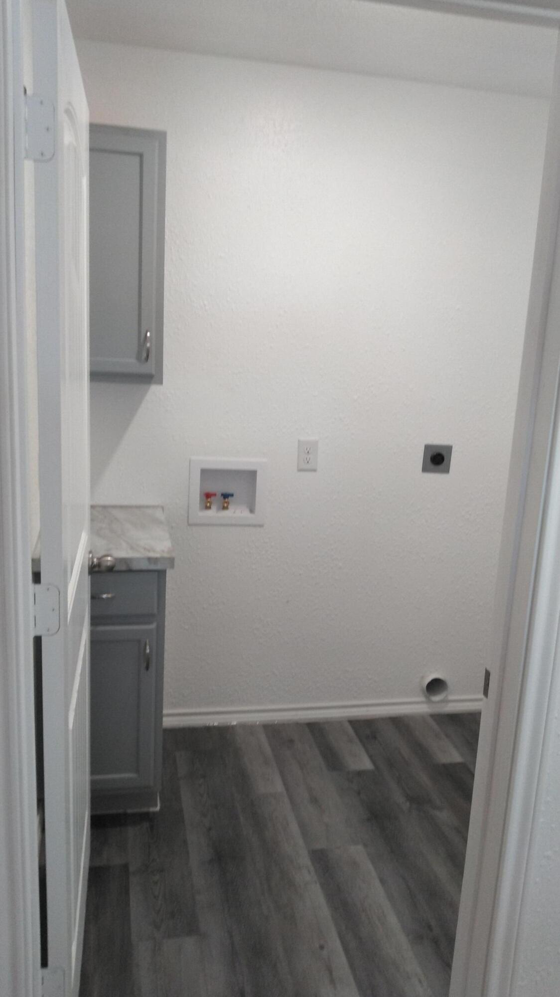 1101 14th Street Lubbock, TX 79401 - Photo 4 of 19 a view of a storage and utility room with a sink