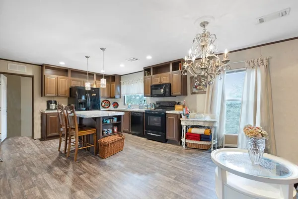 a kitchen with stainless steel appliances a sink stove and refrigerator