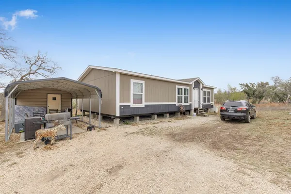 a house with yard in front of it